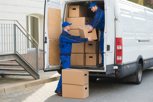 Moving boxes and household items in a Kingston residential street