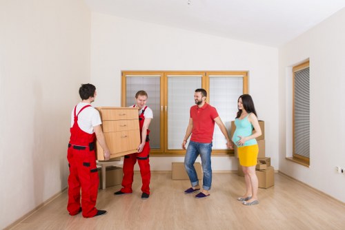Packed office furniture and files prepared for a Kingston move