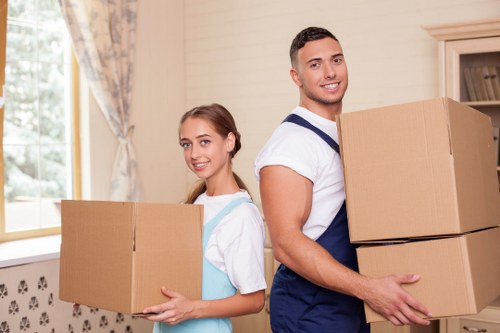 Commercial office items prepared for transport in Kingston by removal van