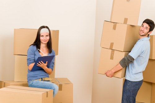 Local office relocation team preparing business items for transport in Kingston