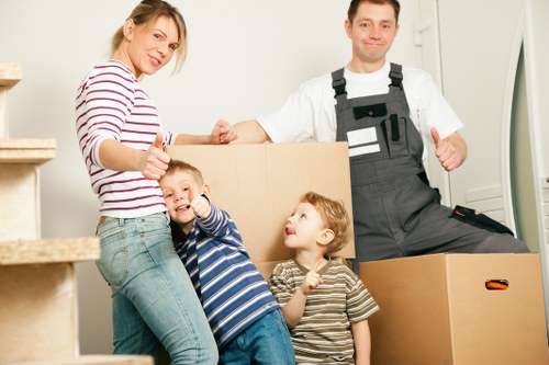 Packed moving boxes and furniture ready for a Kingston home relocation